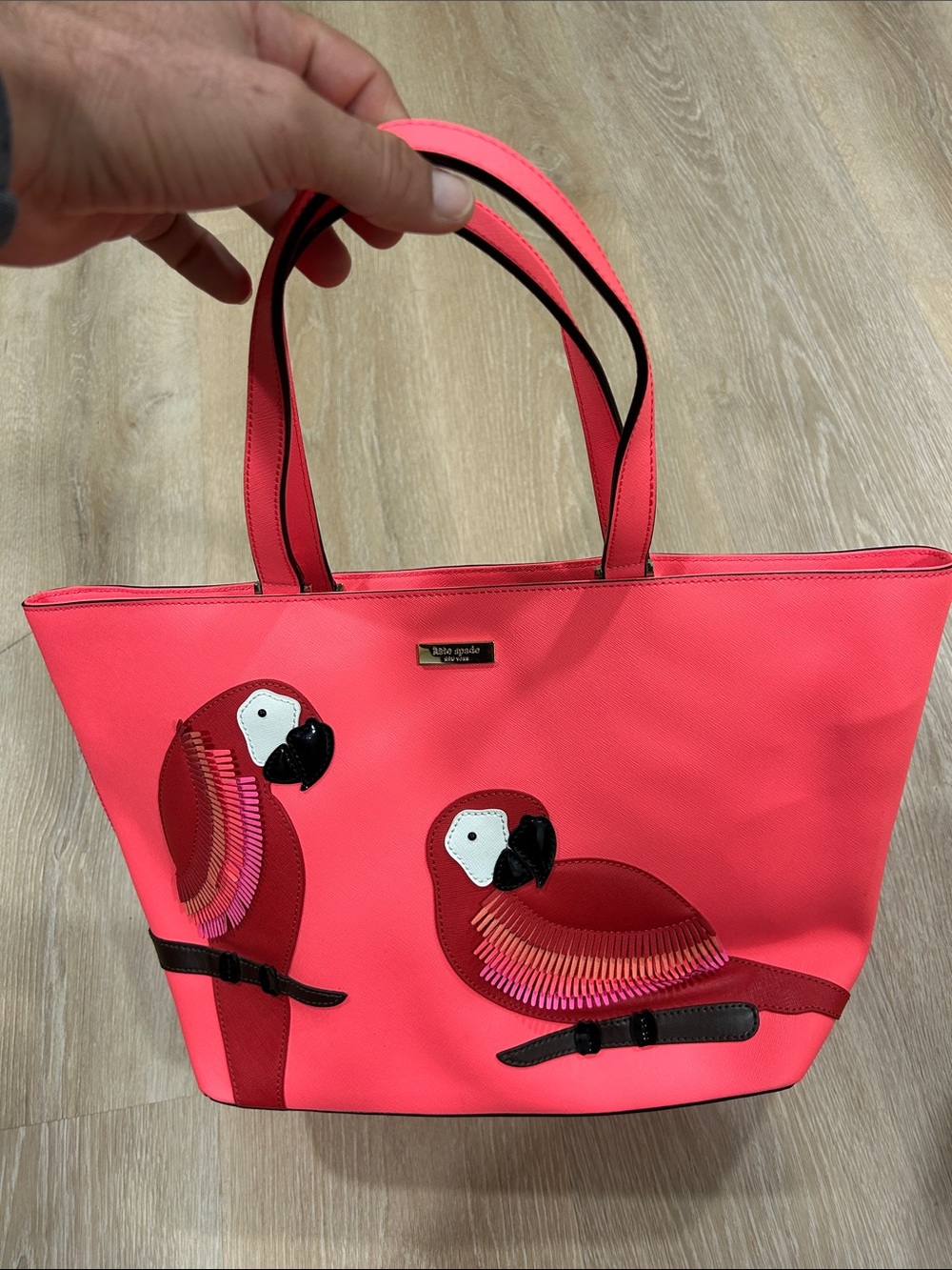 kate spade coral tote with parrot appliqués